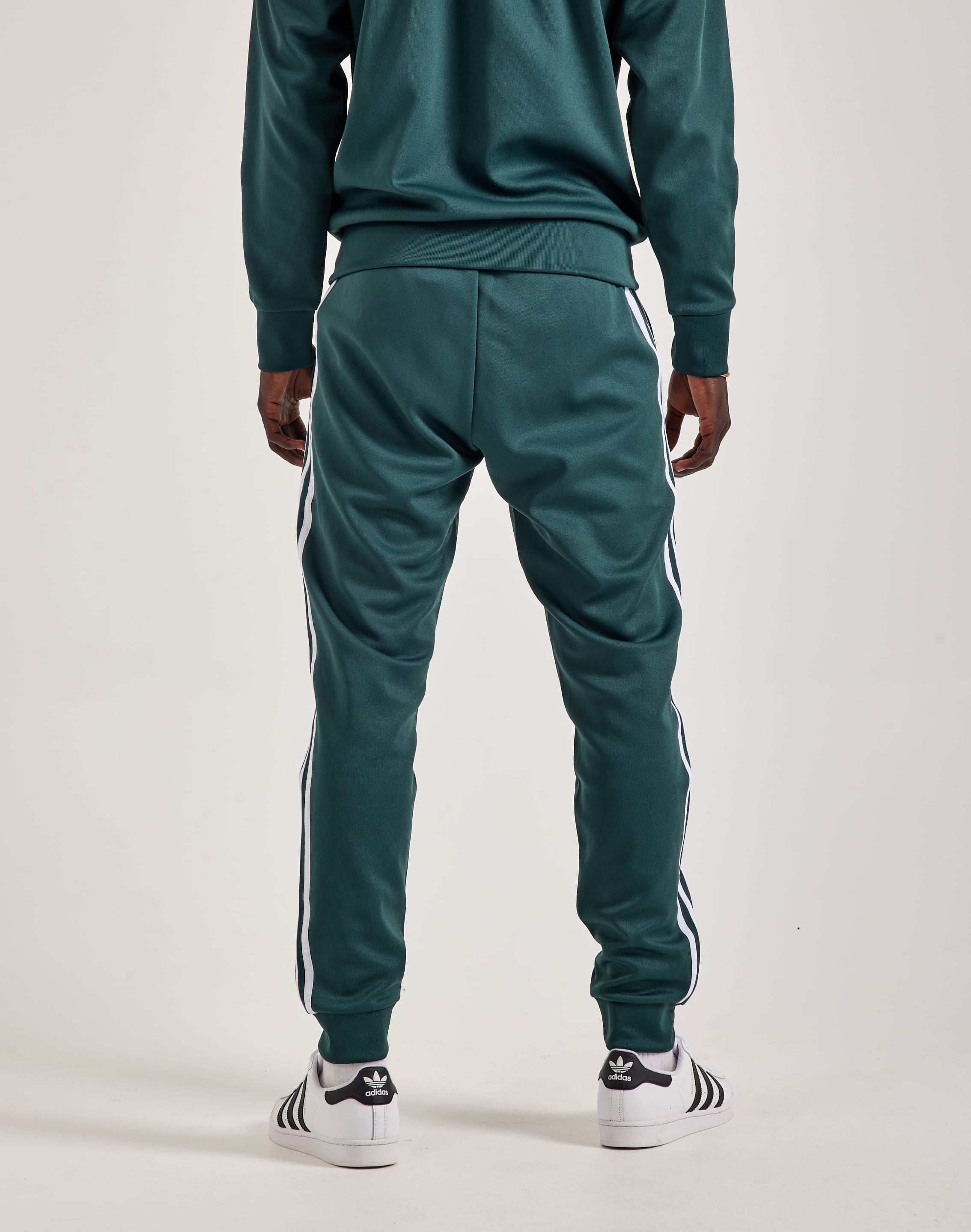 Adidas sst track pants mens green online