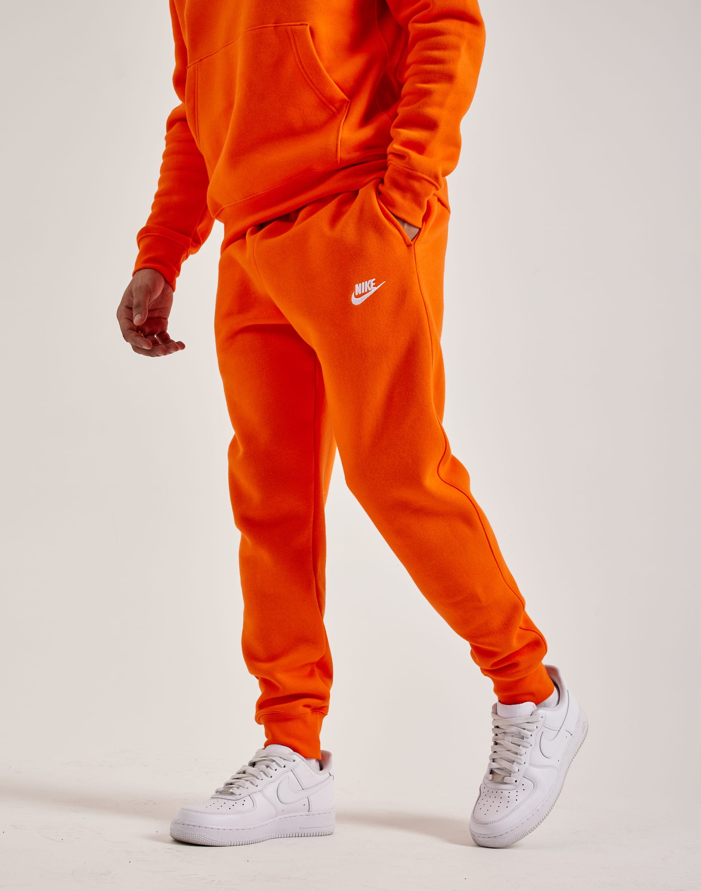 Orange nike jogging suit best sale